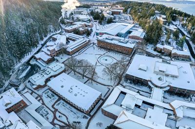 an aerial view of snow-covered rooftops on campus