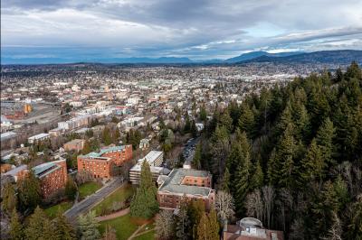 aerial view of WWU on-campus housing and downtown apartment buildings beneath cloudy winter skies
